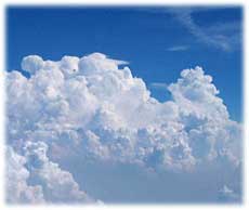 Clouds against a deep blue sky.